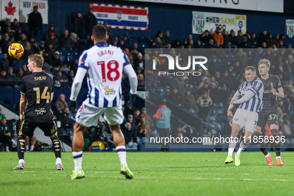 #7, Jed Wallace of WBA takes a shot pressed by #37, Norman Bassette of Coventry during the Sky Bet Championship match between West Bromwich...