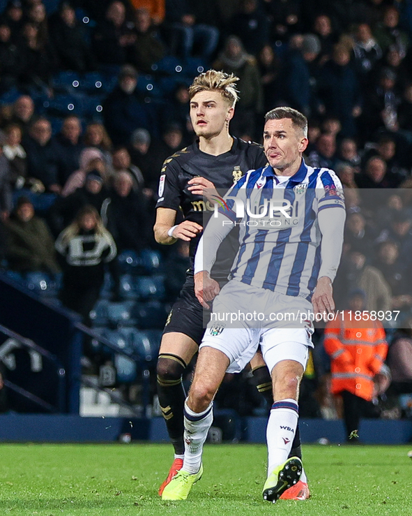 #7, Jed Wallace of WBA/ & #37, Norman Bassette of Coventry in action during the Sky Bet Championship match between West Bromwich Albion and...