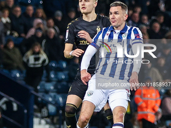 #7, Jed Wallace of WBA/ & #37, Norman Bassette of Coventry in action during the Sky Bet Championship match between West Bromwich Albion and...