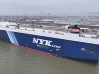 Cars are loaded and unloaded at a ro-ro vehicle terminal for export at Taicang Port area in Suzhou, East China's Jiangsu province, on Decemb...