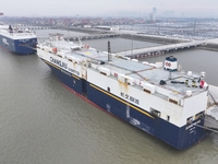 Cars are loaded and unloaded at a ro-ro vehicle terminal for export at Taicang Port area in Suzhou, East China's Jiangsu province, on Decemb...