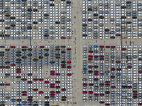 Cars are loaded and unloaded at a ro-ro vehicle terminal for export at Taicang Port area in Suzhou, East China's Jiangsu province, on Decemb...