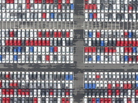 Cars are loaded and unloaded at a ro-ro vehicle terminal for export at Taicang Port area in Suzhou, East China's Jiangsu province, on Decemb...