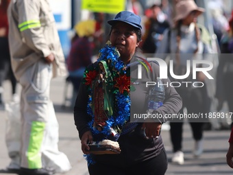 Thousands of Catholic pilgrims continue their journey to the Basilica of Guadalupe for the religious celebration of the Virgin of Guadalupe...