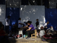 Pilgrims from different states of the Mexican Republic eat on the street during their journey to the Basilica of Guadalupe located in Mexico...