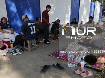 Pilgrims from different states of the Mexican Republic eat on the street during their journey to the Basilica of Guadalupe located in Mexico...