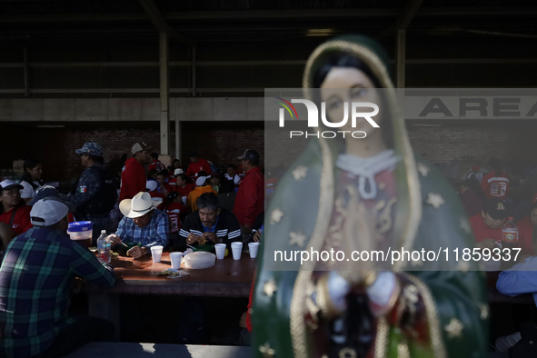 Pilgrims from different states of the Mexican Republic eat at a hostel during their journey to the Basilica of Guadalupe in Mexico City, Mex...