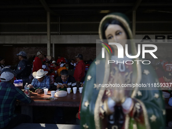 Pilgrims from different states of the Mexican Republic eat at a hostel during their journey to the Basilica of Guadalupe in Mexico City, Mex...