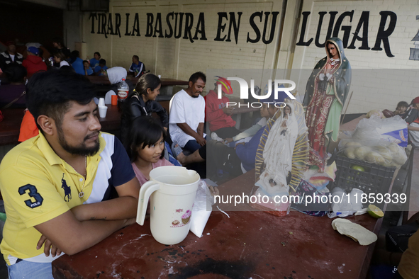 Pilgrims from different states of the Mexican Republic eat at a hostel during their journey to the Basilica of Guadalupe in Mexico City, Mex...