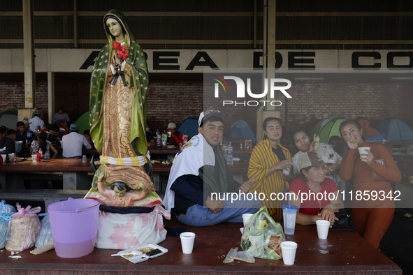 Pilgrims from different states of the Mexican Republic eat at a hostel during their journey to the Basilica of Guadalupe in Mexico City, Mex...