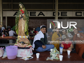 Pilgrims from different states of the Mexican Republic eat at a hostel during their journey to the Basilica of Guadalupe in Mexico City, Mex...