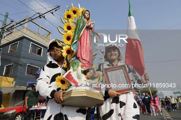 Pilgrims from different states of the Mexican Republic pose during their journey to the Basilica of Guadalupe in Mexico City, Mexico, on Dec...