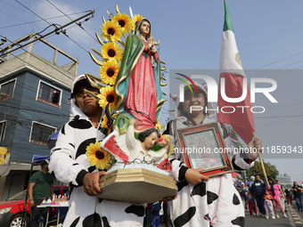 Pilgrims from different states of the Mexican Republic pose during their journey to the Basilica of Guadalupe in Mexico City, Mexico, on Dec...