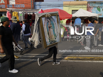 Pilgrims from different states of the Mexican Republic attend the Basilica of Guadalupe in Mexico City, Mexico, on December 11, 2024, for th...