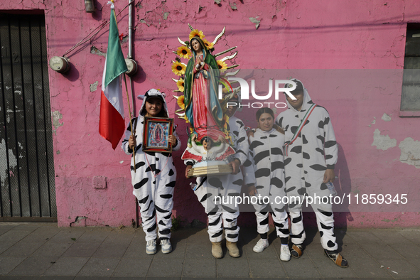 Pilgrims from different states of the Mexican Republic pose during their journey to the Basilica of Guadalupe in Mexico City, Mexico, on Dec...