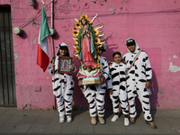 Pilgrims from different states of the Mexican Republic pose during their journey to the Basilica of Guadalupe in Mexico City, Mexico, on Dec...