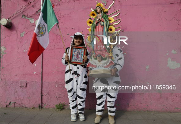 Pilgrims from different states of the Mexican Republic pose during their journey to the Basilica of Guadalupe in Mexico City, Mexico, on Dec...