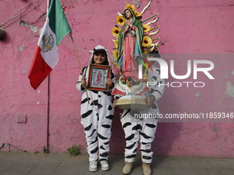 Pilgrims from different states of the Mexican Republic pose during their journey to the Basilica of Guadalupe in Mexico City, Mexico, on Dec...