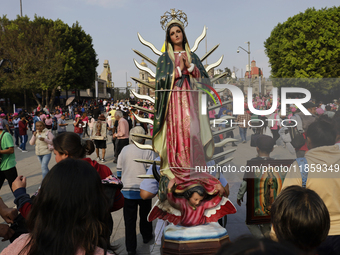 Pilgrims from different states of the Mexican Republic attend the Basilica of Guadalupe in Mexico City, Mexico, on December 11, 2024, for th...