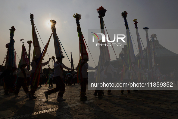 Dancers perform outside the Basilica of Guadalupe in Mexico City, Mexico, on December 11, 2024, during the celebration of the Day of the Vir...