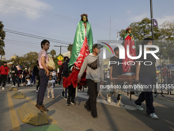 Pilgrims from different states of the Mexican Republic attend the Basilica of Guadalupe in Mexico City, Mexico, on December 11, 2024, for th...