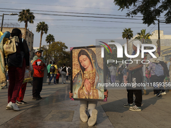 Pilgrims from different states of the Mexican Republic attend the Basilica of Guadalupe in Mexico City, Mexico, on December 11, 2024, for th...