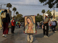 Pilgrims from different states of the Mexican Republic attend the Basilica of Guadalupe in Mexico City, Mexico, on December 11, 2024, for th...