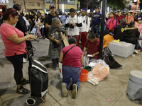 Pilgrims from different states of the Mexican Republic eat on the street during their journey to the Basilica of Guadalupe located in Mexico...