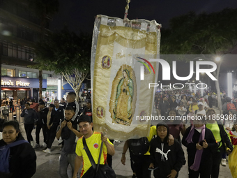 Pilgrims from different states of the Mexican Republic attend the Basilica of Guadalupe in Mexico City, Mexico, on December 11, 2024, for th...