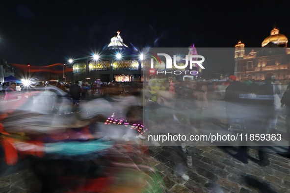 Thousands of Catholic pilgrims arrive at the Basilica of Guadalupe for the religious celebration of the Virgin of Guadalupe Day in Mexico Ci...