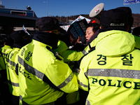 Protesters hold portraits of President Yoon Suk-yeol with the phrase ''Arrest Yoon Suk-yeol, the Rebellion Leader'' written on them as they...