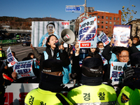 Protesters hold portraits of President Yoon Suk-yeol with the phrase ''Arrest Yoon Suk-yeol, the Rebellion Leader'' written on them as they...