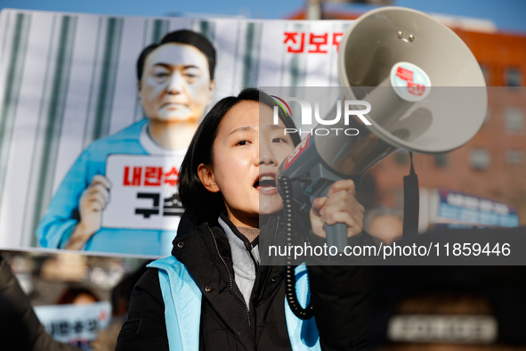 Protesters hold portraits of President Yoon Suk-yeol with the phrase ''Arrest Yoon Suk-yeol, the Rebellion Leader'' written on them as they...