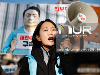 Protesters hold portraits of President Yoon Suk-yeol with the phrase ''Arrest Yoon Suk-yeol, the Rebellion Leader'' written on them as they...