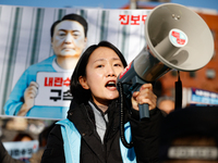 Protesters hold portraits of President Yoon Suk-yeol with the phrase ''Arrest Yoon Suk-yeol, the Rebellion Leader'' written on them as they...