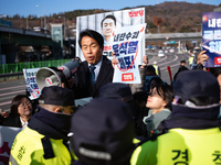 Protesters hold portraits of President Yoon Suk-yeol with the phrase ''Arrest Yoon Suk-yeol, the Rebellion Leader'' written on them as they...