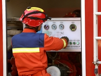 A comprehensive combat drill for forest fire emergency response takes place in Qingdao, China, on December 11, 2024. (