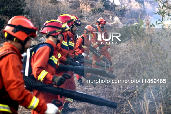 A comprehensive combat drill for forest fire emergency response takes place in Qingdao, China, on December 11, 2024. 