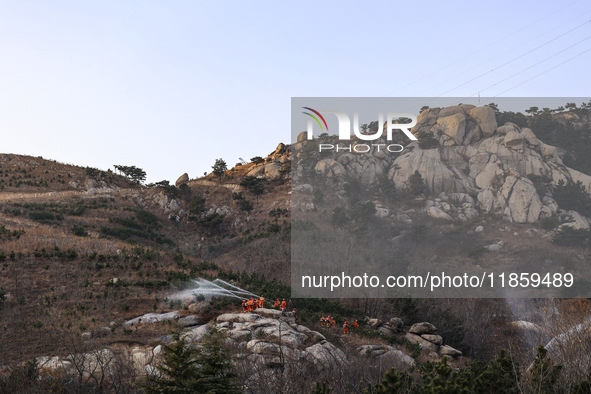 A comprehensive combat drill for forest fire emergency response takes place in Qingdao, China, on December 11, 2024. 