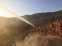 A comprehensive combat drill for forest fire emergency response takes place in Qingdao, China, on December 11, 2024. (