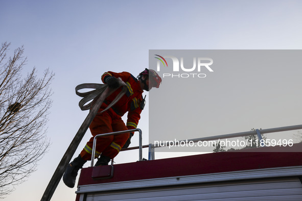 A comprehensive combat drill for forest fire emergency response takes place in Qingdao, China, on December 11, 2024. 