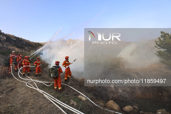 A comprehensive combat drill for forest fire emergency response takes place in Qingdao, China, on December 11, 2024. 