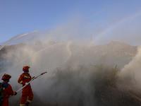 A comprehensive combat drill for forest fire emergency response takes place in Qingdao, China, on December 11, 2024. (