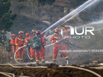 A comprehensive combat drill for forest fire emergency response takes place in Qingdao, China, on December 11, 2024. (