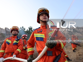 A comprehensive combat drill for forest fire emergency response takes place in Qingdao, China, on December 11, 2024. (