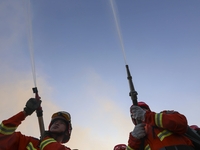 A comprehensive combat drill for forest fire emergency response takes place in Qingdao, China, on December 11, 2024. (