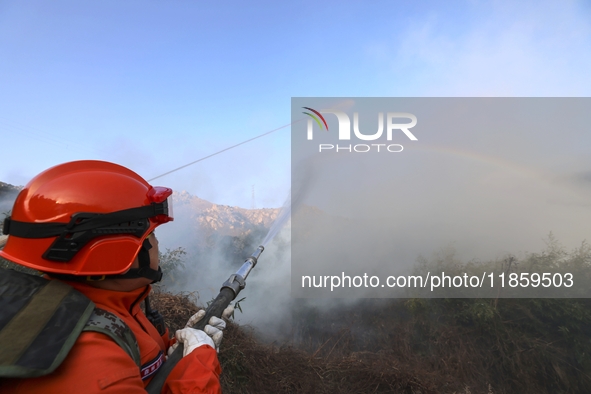 A comprehensive combat drill for forest fire emergency response takes place in Qingdao, China, on December 11, 2024. 