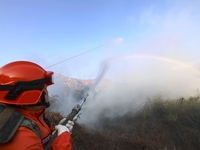 A comprehensive combat drill for forest fire emergency response takes place in Qingdao, China, on December 11, 2024. (