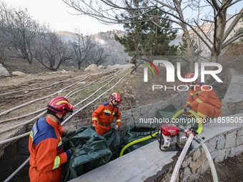 A comprehensive combat drill for forest fire emergency response takes place in Qingdao, China, on December 11, 2024. (