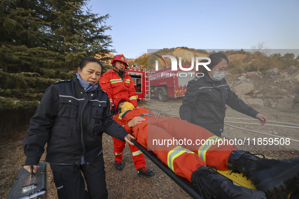 A comprehensive combat drill for forest fire emergency response takes place in Qingdao, China, on December 11, 2024. 